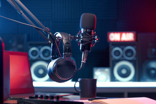 Professional microphone and headphones at the radio station, entertainment and communication concept